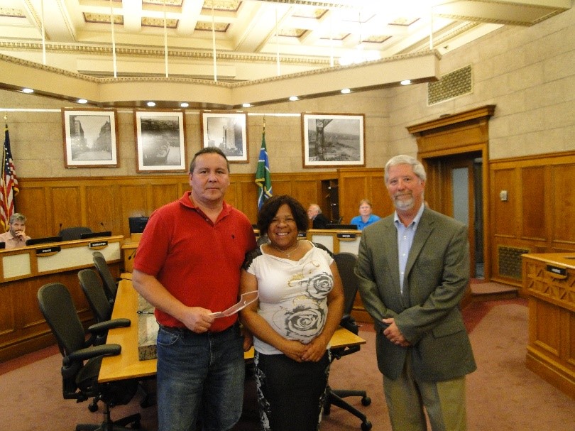 Michael Murray Jr from the Fond du Lac Reservation with Planning Commission President Janet Kennedy and Director Keith Hamre